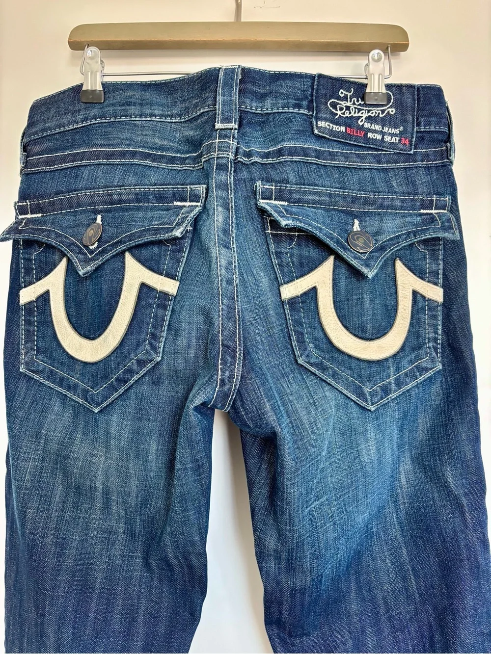 Vintage made in USA True Religion men’s dark blue bootcut jeans, leather accent